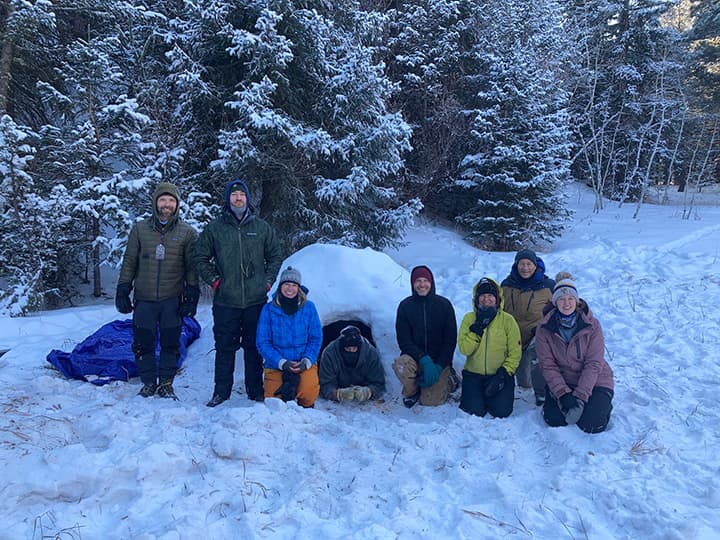Team building group outdoors in the snow